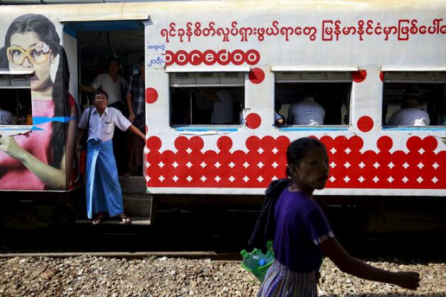 People ride a train as they travel to Yangon./Reuters